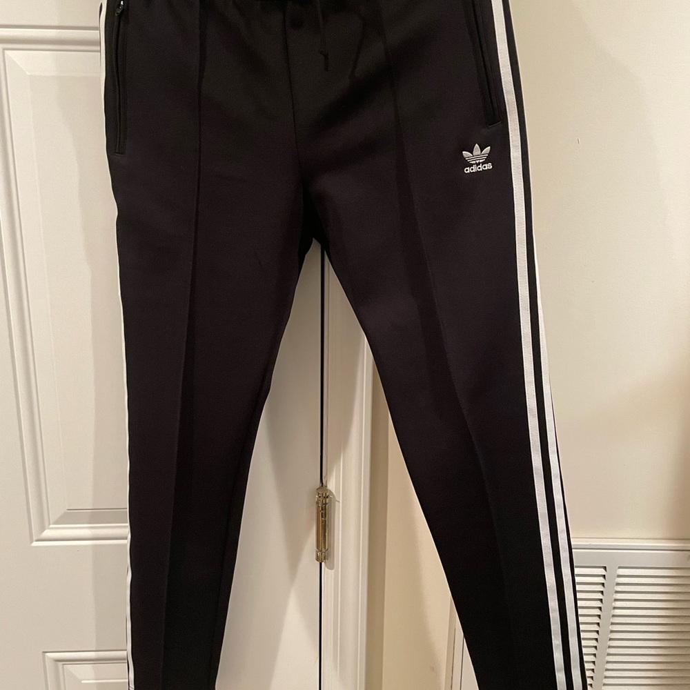 Adidas’s black and white women’s track suit.